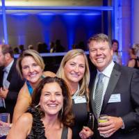 Guests laughing in the Laker Lounge